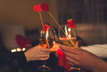 Valentines Day Couple In Love Clinking Glasses Drinks Wine With Strawberries Having Romantic Dinner Celebrating At Home