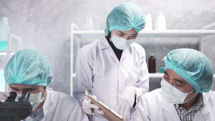 Wall Mural - medical scientist team are working on science laboratory research term by using microscope and scien