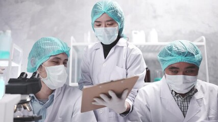 Wall Mural - medical scientist team are working on science laboratory research term by using microscope and scien