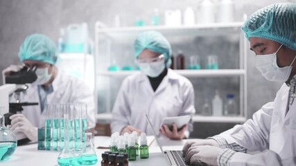 Wall Mural - medical scientist team are working on science laboratory research term by using microscope and scien