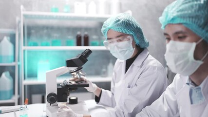 Wall Mural - medical scientist team are working on science laboratory research term by using microscope and scien