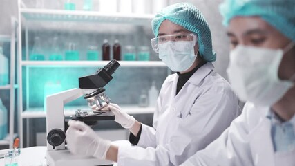 Wall Mural - medical scientist team are working on science laboratory research term by using microscope and scien