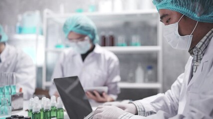 Wall Mural - medical scientist team are working on science laboratory research term by using microscope and scien