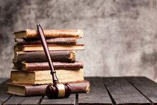 Legal Law And Justice Concept - Old Law Book With A Wooden Judges Gavel On Table In A Courtroom Or Law Enforcement Office. Copy Space For Text.