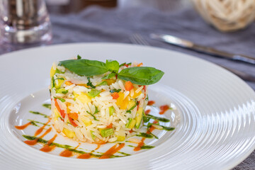 Wall Mural - fried rice with vegetables on a white plate