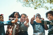 Our favourite summer camp by far. Shot of a group of teenagers showing thumbs up at summer camp.