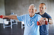 © Yuri Arcurs/peopleimages.com - You're getting stronger every day. Shot of a physiotherapist helping a senior man with weights.