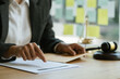 © PaeGAG - Justice and law concept. Lawyer businesswoman working on table office.
