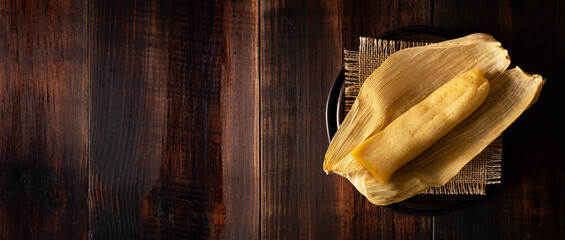 Wall Mural - Tamales. Prehispanic dish typical of Mexico and some Latin American countries. Corn dough wrapped in corn leaves. The tamales are steamed.