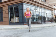 © splitov27 - Young woman in overalls runs on in sports clothes outdoors