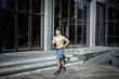 © splitov27 - Young athletic runner man doing jogging outdoors. Cardio workout, healthy lifestyle