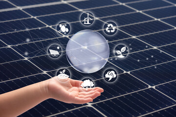 Wall Mural - Child’s holding hands Solar cell and eco icon over solar cell system, Solar cell energy, Care of the Environment, clean energy, Ecology concept.