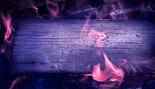 Burning Deep Violet Horizontal Board With Open Purple Fire Flame. Violet Burned Wooden Board Texture. Burnt Wooden Board. Burned Scratched Hardwood Surface. Smoking Wood Plank Background