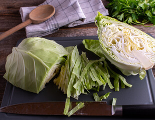 Wall Mural - fresh cabbage on a cutting board with knife