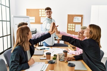 Group of business workers smiling happy celebrating with hands together at the office