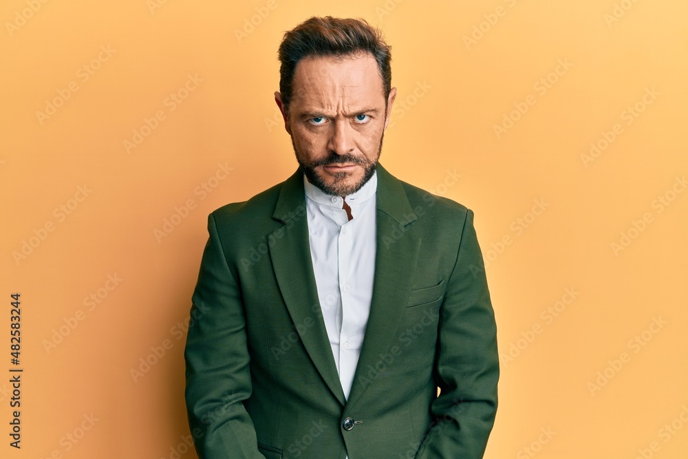 Middle age man wearing business suit skeptic and nervous, frowning upset because of problem. negative person.