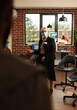© DC Studio - Close up of psychotherapist woman helping people at group therapy session, standing in office to give counseling. AA meeting psychologist giving advice to alcoholic patients during pandemic