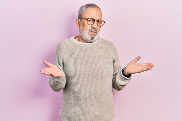 Sticker - Handsome senior man with beard wearing casual sweater and glasses clueless and confused with open arms, no idea concept.