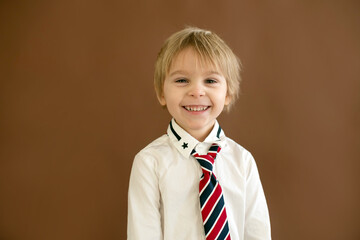 Poster - Cute toddler child, boy with smart casual clothing on isolated background, showing different emotions