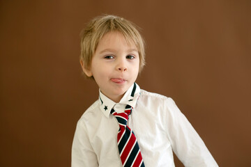 Wall Mural - Cute toddler child, boy with smart casual clothing on isolated background, showing different emotions