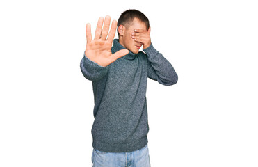 Poster - Young blond man wearing casual clothes covering eyes with hands and doing stop gesture with sad and fear expression. embarrassed and negative concept.