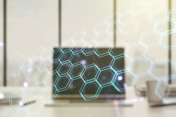 Wall Mural - Creative concept of wireless technology with hexagon hologram on modern laptop background. Big data and database concept. Multiexposure