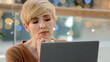 © Yuliia - Thoughtful serious doubtful smart middle aged adult 40s woman pensive lady looking away thinking future vision solving problem difficult question business challenges working with laptop feeling doubt