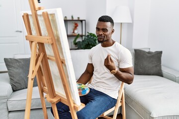 Wall Mural - Young african man painting on canvas at home doing money gesture with hands, asking for salary payment, millionaire business