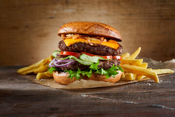 Wall Mural - Double burger with fries on table