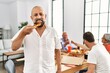 © Krakenimages.com - Group of middle age people smiling happy eating italian pizza sitting on the table at home