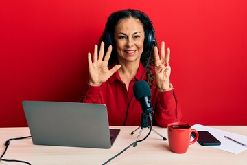 Sticker - Beautiful middle age woman working at radio studio showing and pointing up with fingers number eight while smiling confident and happy.