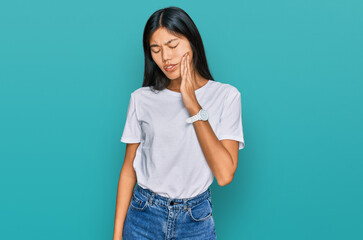 Sticker - Beautiful young asian woman wearing casual white t shirt touching mouth with hand with painful expression because of toothache or dental illness on teeth. dentist