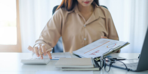 Wall Mural - Business woman working to analyze technical price graph and indicator. account or saving money or insurance concept.