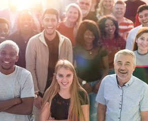 multi ethnic group of different people standing together.