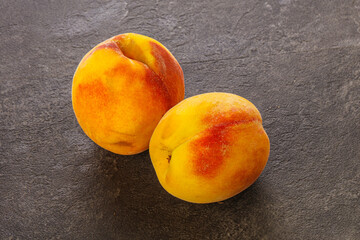 Two Sweet ripe tasty peaches