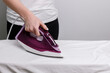 © BartLoveyou - woman ironing close-up with iron