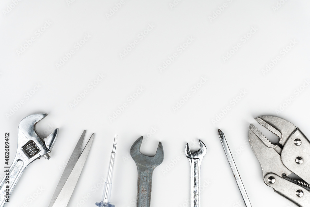 Worktable top view of Repair tools Flat lay composition on white background, construction and home DIY, space for text