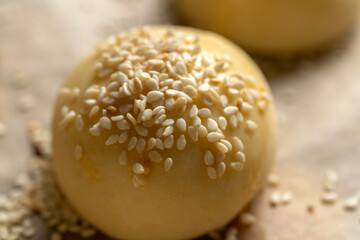 Wall Mural - Hamburger bun with sesame seeds Shallow depth of field.