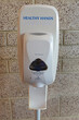 Hand sanitizer in a public place near the wall at the entrance to a public building. Hand sanitizer.