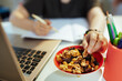 © Alliance - Modern pupil having online education and eating healthy snack