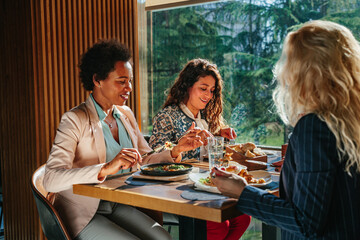 Wall Mural - Three business women having lunch break