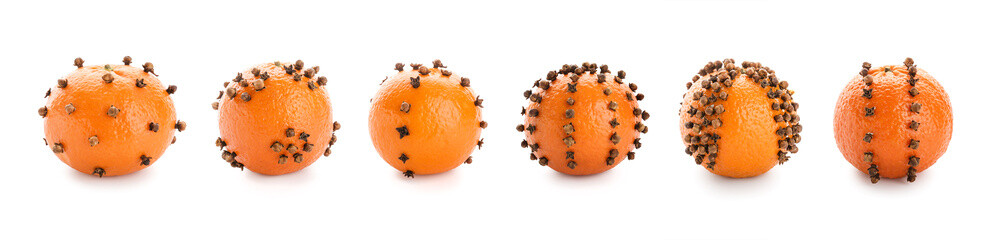 Set of orange pomander balls on white background