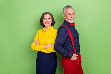 Wall Mural - Photo of two friendly successful people folded arms pockets look camera isolated on green color background