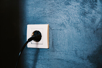 Close up of a electrical outlet with cable.