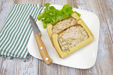 slice of chicken mustard pâté en croute on a plate