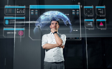 Wall Mural - business, technology and people concept - businessman looking at virtual projection of earth planet 