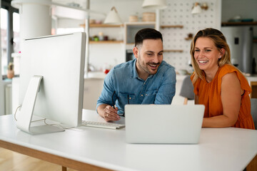 Programmers cooperating at IT company developing apps