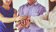 © lenets_tan - Group of business hands holding a fresh young sprout. Symbol of growing and green business