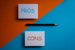 © robert - pros and cons decision making background ,for and against on blue and orange graphic background .