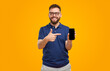 © kegfire - Man pointing at smartphone with black screen